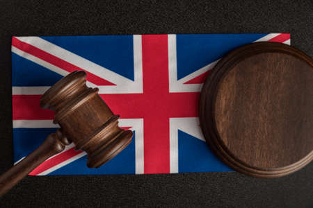Judge gavel on the flag United Kingdom. Law and legality in UK. Violation of human rights.の写真素材