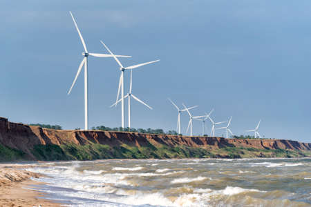 Wind turbines on the sea coast. Wind energy. Alternative energy.