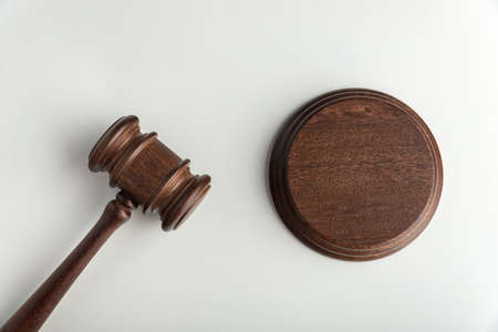 Wooden judge gavel and sound Board. Top view. Auction. White background.の写真素材