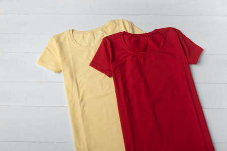 Red and yellow cotton t-shirt unisex. Cotton blank t-shirt. Mockup.の写真素材