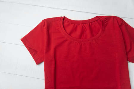 Red cotton blank t-shirt on white background. Unisex knitted t-shirt. Mockup.