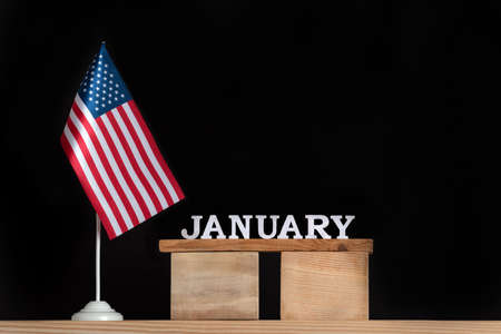 Wooden calendar of January with USA flag on black background. Holidays of the United States of America in January.の写真素材