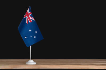 National table flag of Australia on black background. Flag pole. Copy space.の写真素材