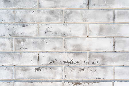 White grunge brick wall background. Old wall from silicate brick. Construction background