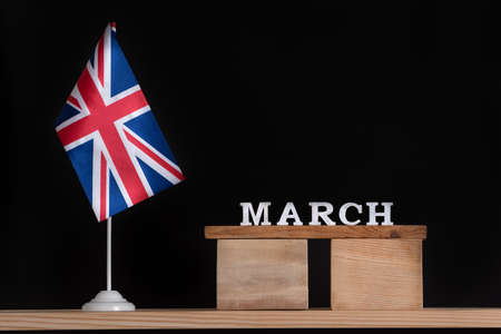Wooden calendar of March with Great Britain flag on black background. Spring holidays of UKの写真素材