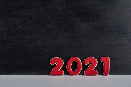 Red numbers 2021 on black background. Copy space.の写真素材