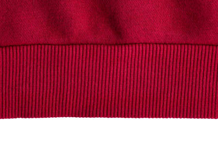 Knitted red elastic band on white background. Piece of clothing.