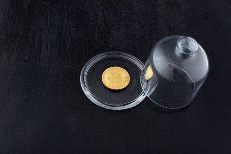 Bitcoin without glass cover. Bitcoin and bubble. Concept of instability of cryptocurrency and...