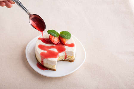 Fruit cheesecake, with fresh strawberries and berry juice. Classic dessert.の写真素材