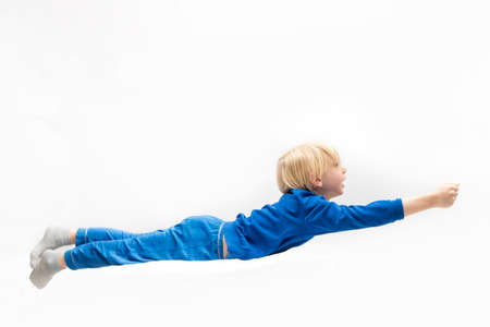 Little boy flying  . Dreaming. White backgroundの写真素材