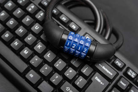 Combination lock and keyboard close up. Data protection concept. Cyber secure.の写真素材