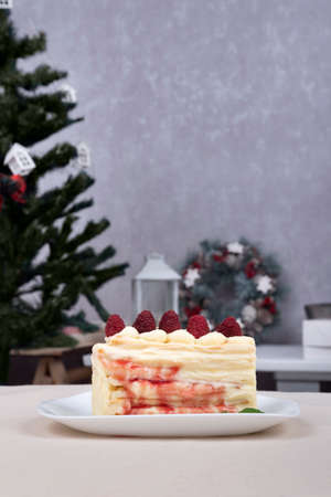 Piece of fruit pie on plate. Cake with berries. Christmas background. Vertical frame.の写真素材