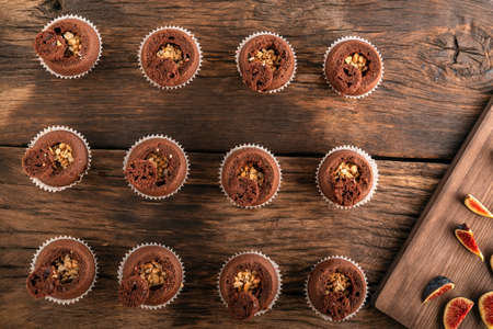 Preparation of chocolate cupcakes with nut filling. Homemade cakes. Top view.の写真素材