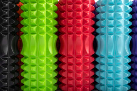 Close-up multicolored massage rollers for body massage. Foam myofascial rollers for physiotherapy. Top view.の写真素材