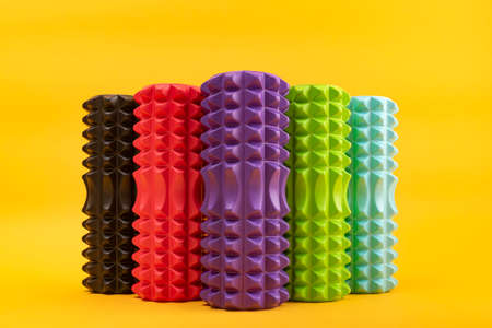 Multicolored rollers for massage. MFR roller relax. Fitness Equipment for self-massage. Front view.