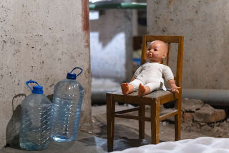 KHARKOV, UKRAINE- 3 MARCH 2022: Toy on chair in basement or bomb shelter. lost childhood. Children lost their childhood because of warのeditorial素材