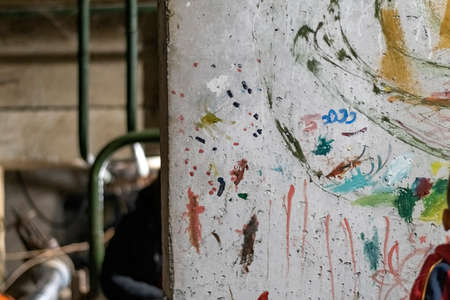KHARKOV, UKRAINE- 3 MARCH 2022: wall with paint streaks. Interior is in basement or bomb shelter, where people hide from shelling of Russian armyのeditorial素材