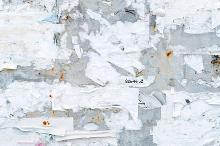abstract background. Rough metal surface with pieces of paper. old information board