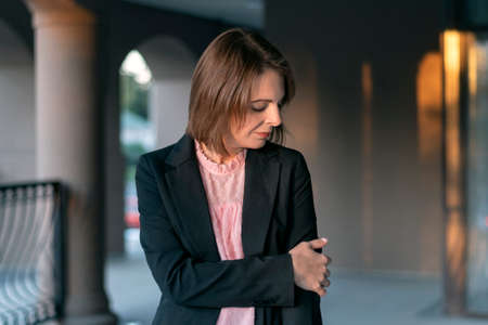 Close-up woman in business suit. Portrait of girl in black jacket. formal attireの写真素材