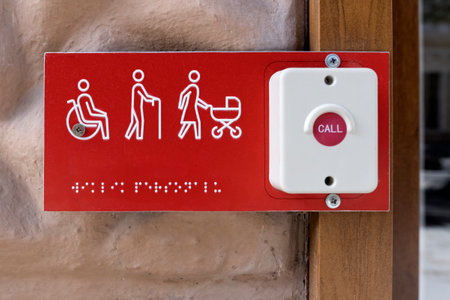Nameplate with the inscription Braille with button. Help disabled, elderly and mothers with babyの写真素材