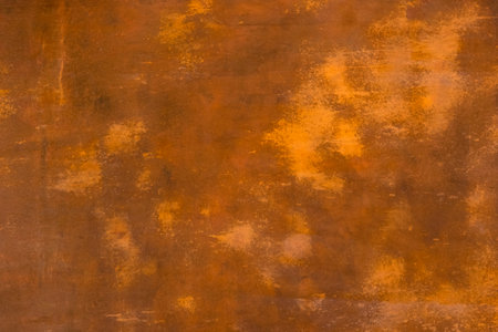Abstract brown terracotta background with spots. Old dilapidated grudge rustic paint coating on the...
