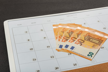 Euro cash money is on calendar. Concept of monthly budget. payday. deposit payments