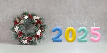 Traditional Christmas wreath and colored number 2025 on gray background. New year. Winter Holiday patternの写真素材