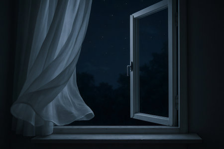 Open window with white curtain blowing in night breeze under starry sky, creating a peaceful and romantic atmosphereの素材