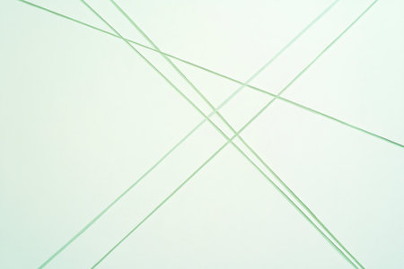 Minimalist artwork featuring intersecting green lines creating a dynamic composition on a white backgroundの素材