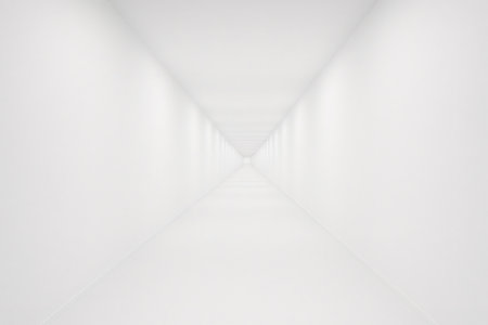 White endless corridor vanishing into the distance creating a vanishing point in a minimalist interior designの素材