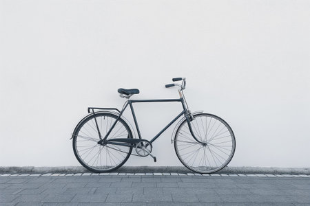 Stylish, simple illustration of a black bicycle on a solid white backgroundの素材