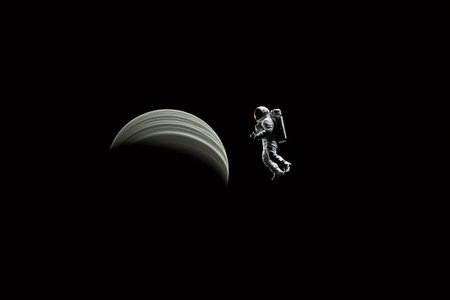 Astronaut floats in the dark vastness of space, dwarfed by the presence of a large, ringed planetの素材
