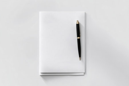 Blank letterhead paper providing copy space for text, with a classic pen ready for writing or signingの素材