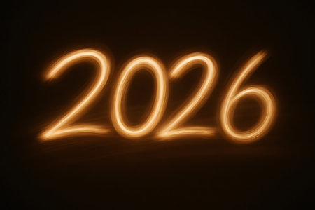 2026 year numbers glowing with light trail effect, symbolizing new beginnings, future, and celebration on dark backgroundの素材