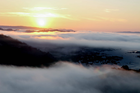 Sunrise over the mountains with the morning mist.の写真素材