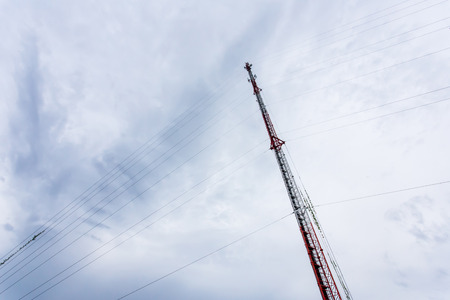 Mobile antenna on background sky