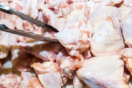 Pliers are cubed raw wingstick, shoot in the marketの写真素材