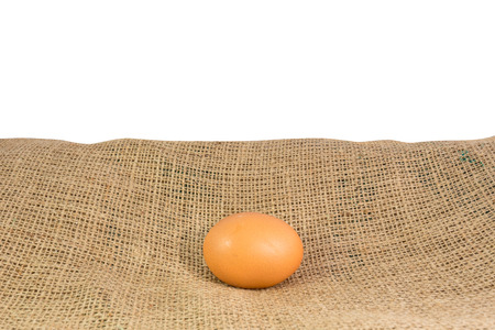egg placed on sackclothの写真素材