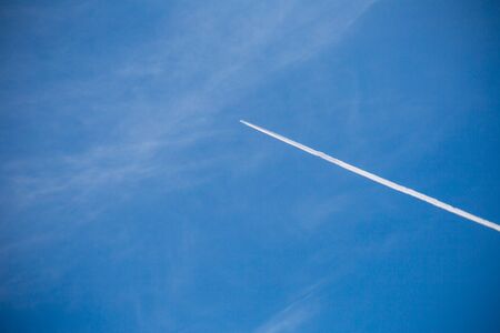 airplane contrail on sky background