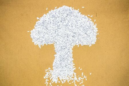 fragment paper from perforation created abstract tree placed on cardboardの写真素材