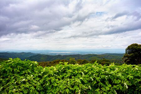 The view from atop a mountain with rainy cloudの写真素材
