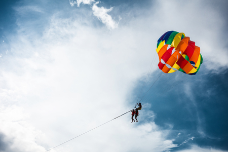 Tourists are playing parasailingの写真素材