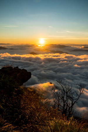 sunrise and sea of fog view on phu chi fa mountain area and national forest park in chiang rai, Thailand.の写真素材