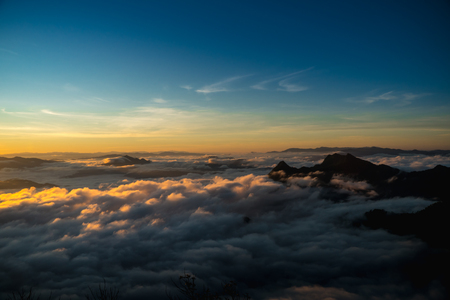 sunrise and sea of fog view on phu chi fa mountain area and national forest park in chiang rai, Thailand.の写真素材