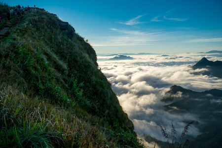 sunrise and sea of fog view on phu chi fa mountain area and national forest park in chiang rai, Thailand.の写真素材