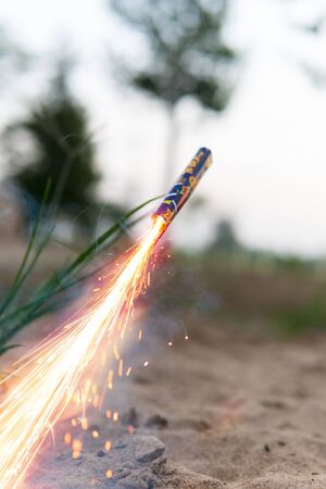 Sparkling of firecrackers rocket launching from the ground