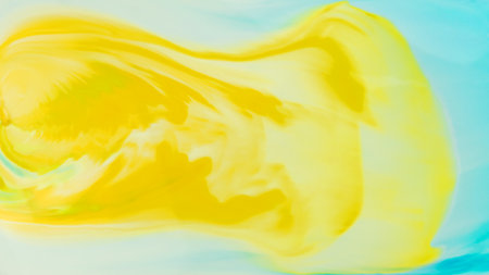 The yellow liquid is spreading on the blue liquid