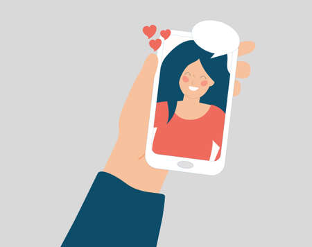 A hand holds a phone and talk in a video call with a happy girl or woman on the screen display. Speech bubble, online smartphone conversation, social media, Couple relationship and friendship concept.のイラスト素材