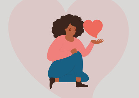 African American woman holds and a big heart. Female care a red heart with care and love while sitting. Woman love and self acceptance concept. Flat vector illustration.のイラスト素材