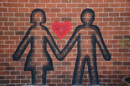 Lover painting on wallの写真素材